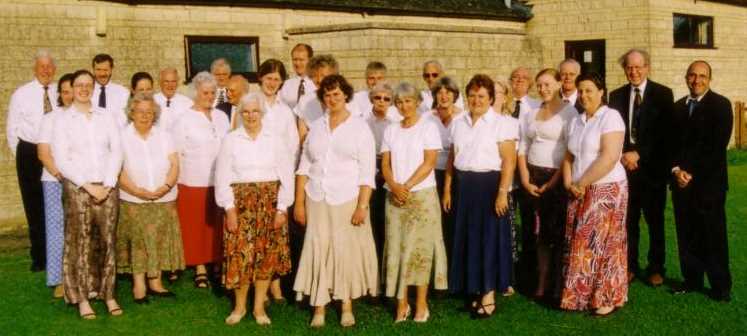 Front row: Caroline Symcox, Pat Purbrick, Dot Gibbons, Debra Warner, Maureen Pendlebury, Joan Prichard 2nd Row:  Meg Greenwood, Floss Williams, Karen Vogt, Joan Falaise, Eileen Yeates, Denise Monk, Sandy, Maggie Marchant Back row: Rex Norman, Mark, Stuart Ramsden, Peter Martin, George Sandals, Sjoerd Vogt, Victor Howlett, Chris Morgan, Robin Greenwood, John Oxlade (Accompanist), Terence Carter (Conductor), Philip Fine (Tenor soloist)